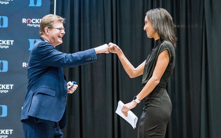 Duke President Vincent Price, left, gives Nina King a fist bump after welcoming her to the stage during her introductory press conference as Duke director of Athletics. Photo courtesy of Duke Athletics.
