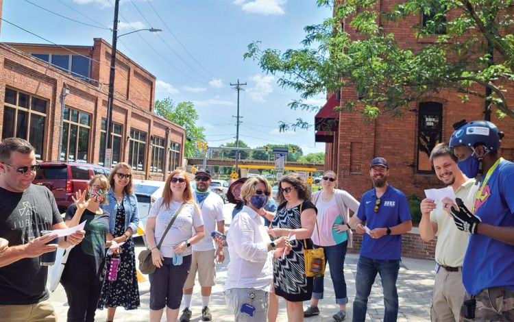 Staff in the Office of Information Technology (OIT) gather in teams for a scavenger hunt through downtown Durham. Photo courtesy of OIT.