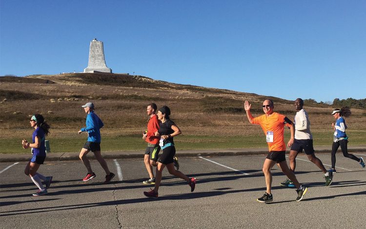 Mark Walters smiles as waves while running the 2016 Outer Banks Marathon in North Carolina. Photo courtesy of Mark Walters.