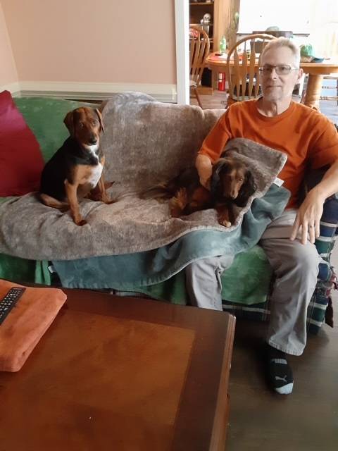 Paul Schuler at home with his dogs, Fritz and Alfredo. Photo courtesy of Paul Schuler.