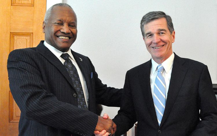 Phail Wynn, left, with North Carolina Governor Roy Cooper during a visit to Duke's campus in 2017. Photo courtesy of University Communications. 