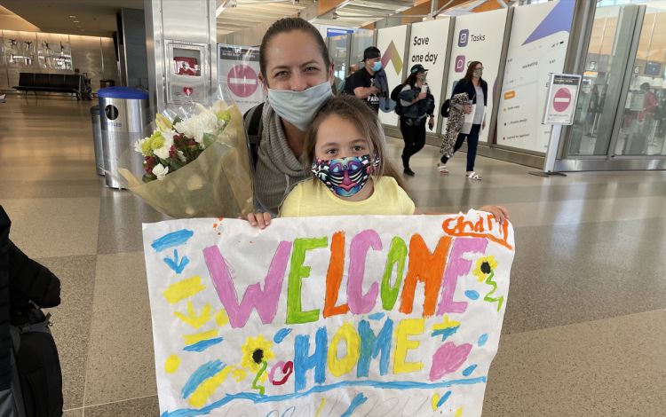 Melissa Babb was greeted with a welcoming committee when she returned to Raleigh-Durham International Airport in March. Photo courtesy of Melissa Babb.
