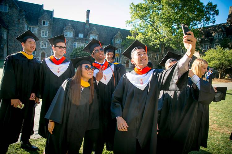 Students take a selfie at the 2017 commencement ceremony
