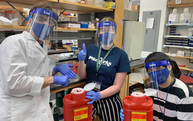 Lab members wear safety gear. 