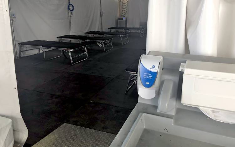 A hand washing station sits outside a tent where clinicians will see patients. Photo courtesy of Duke Regional Hospital.