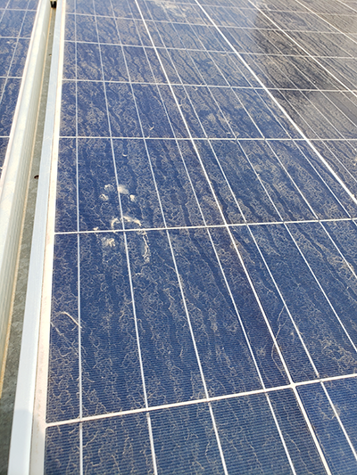 A Duke team is developing a data-driven platform to help solar energy producers optimize their cleaning schedules. Pictured is a lightly soiled panel at a field research site on the campus of India Institute of Technology. Credit: Michael Valerino.  