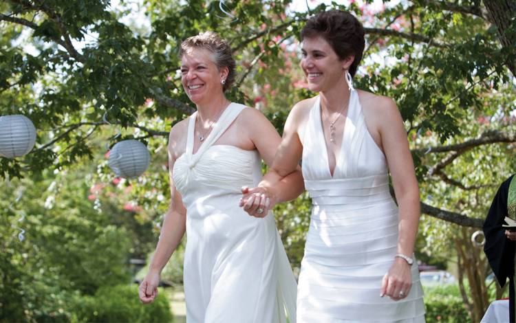 August Burns, right, business manager for Duke’s Fitzpatrick Institute for Photonics, married Denise Ingram in 2012 at their home in Pittsboro, N.C. Photo by Megan Mendenhall and Kim Walker.