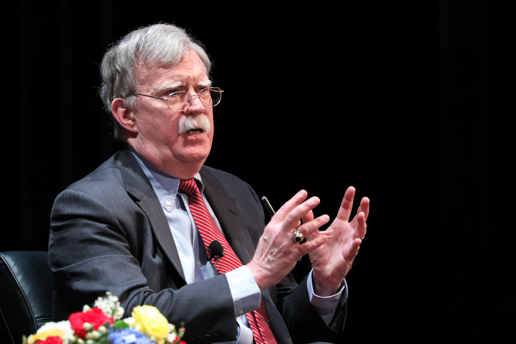 John Bolton addressing the Page Auditorium audience.