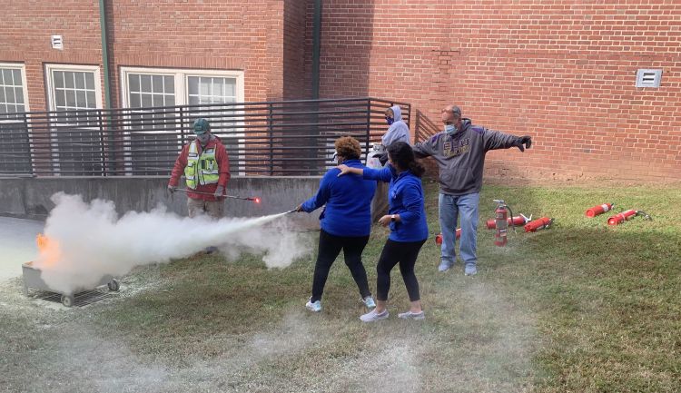 Duke AmeriCorp members Gaelyn Dent and Esperanza Hernandez learned fire safety practices during CERT training