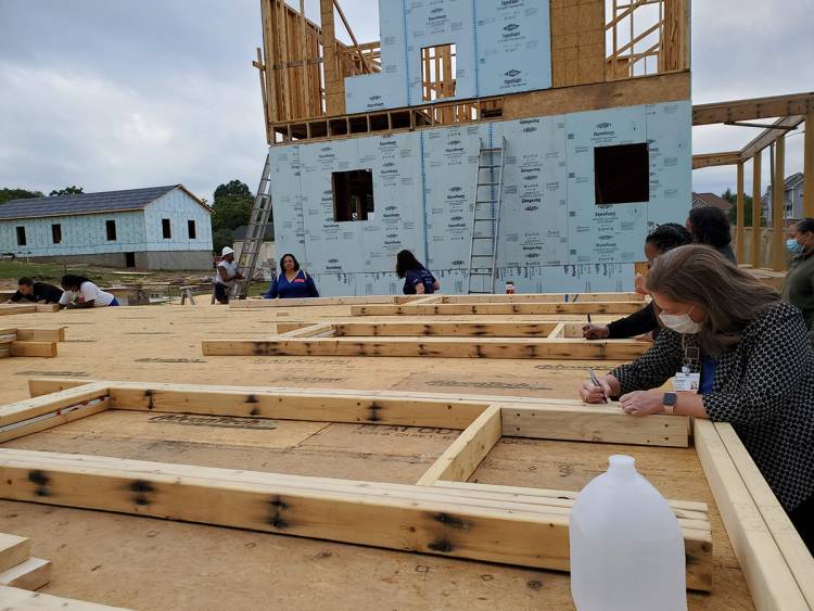 one wall has been placed in the new Habitat house