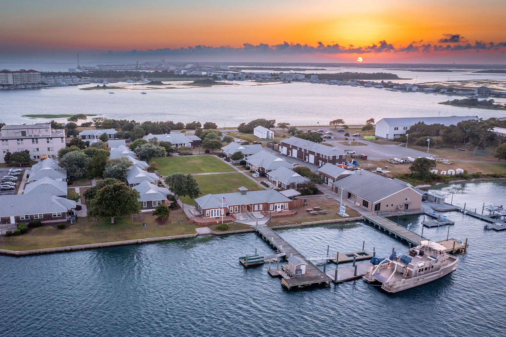 An aerial of the Duke University Marine lab campus with sunset in the background