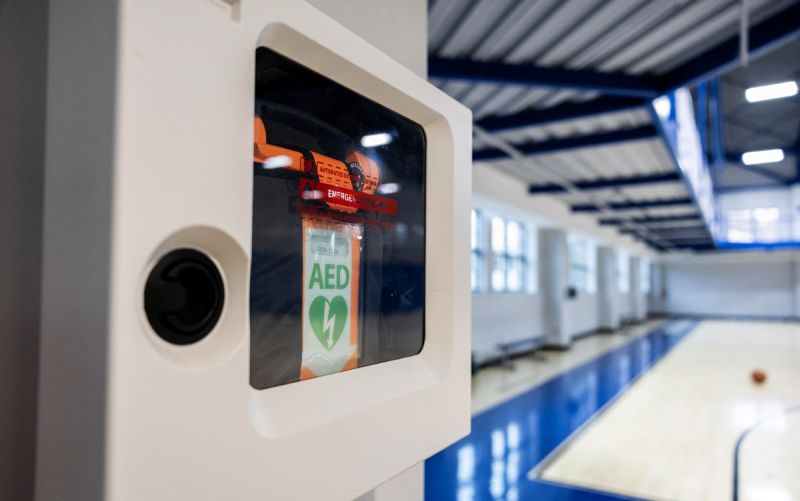 An AED hangs by the basketball court in Wilson Recreation Center at Duke