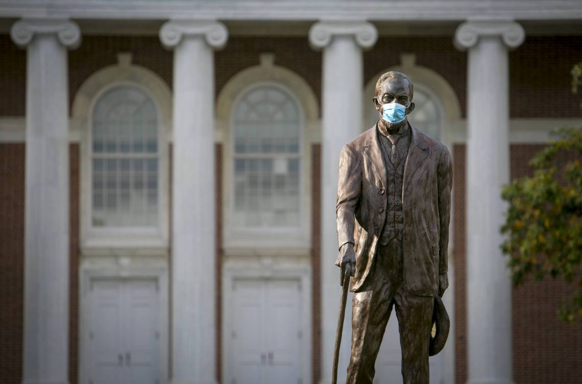 Benjamin Duke statue with a mask on