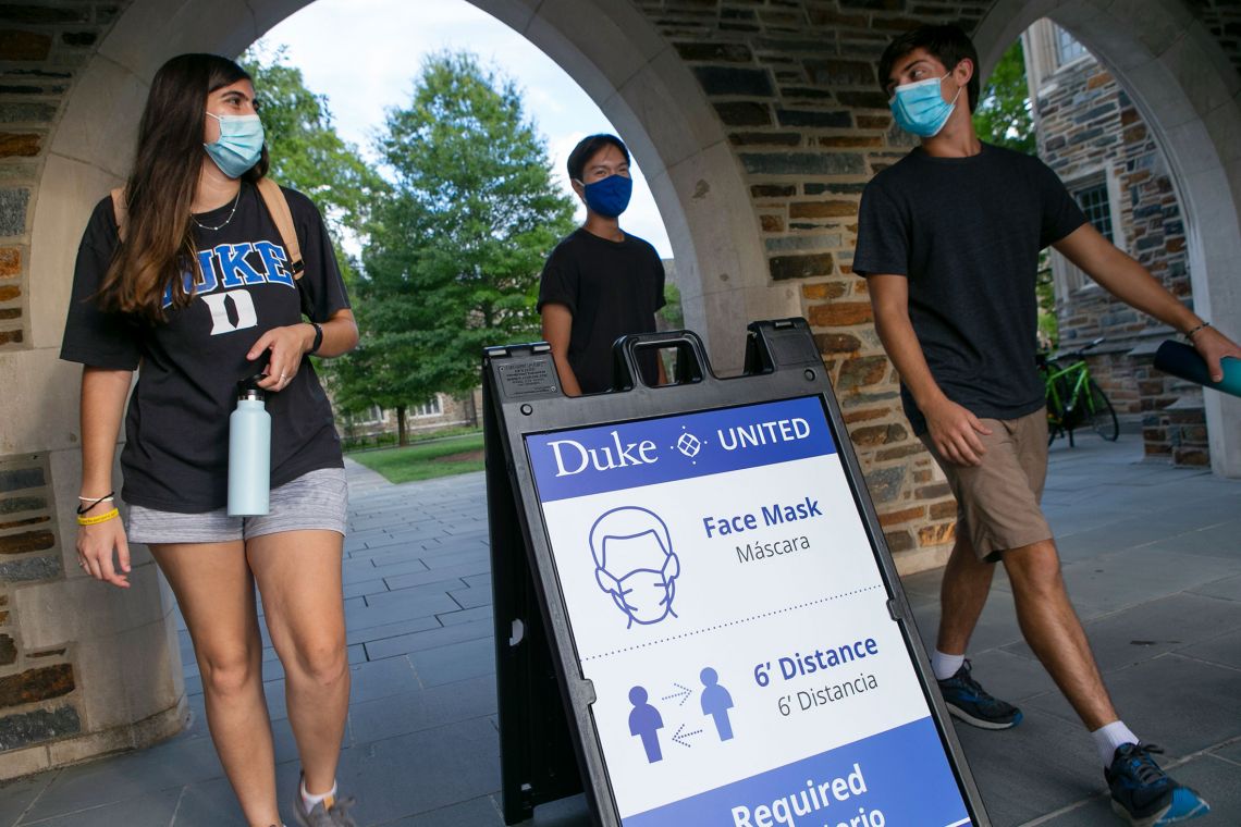 During the pandemic, masked students walk through the Bryan Center Plaza. In his book, Robert Bliwise explores student struggles and successes in pivoting to distanced learning and social life.