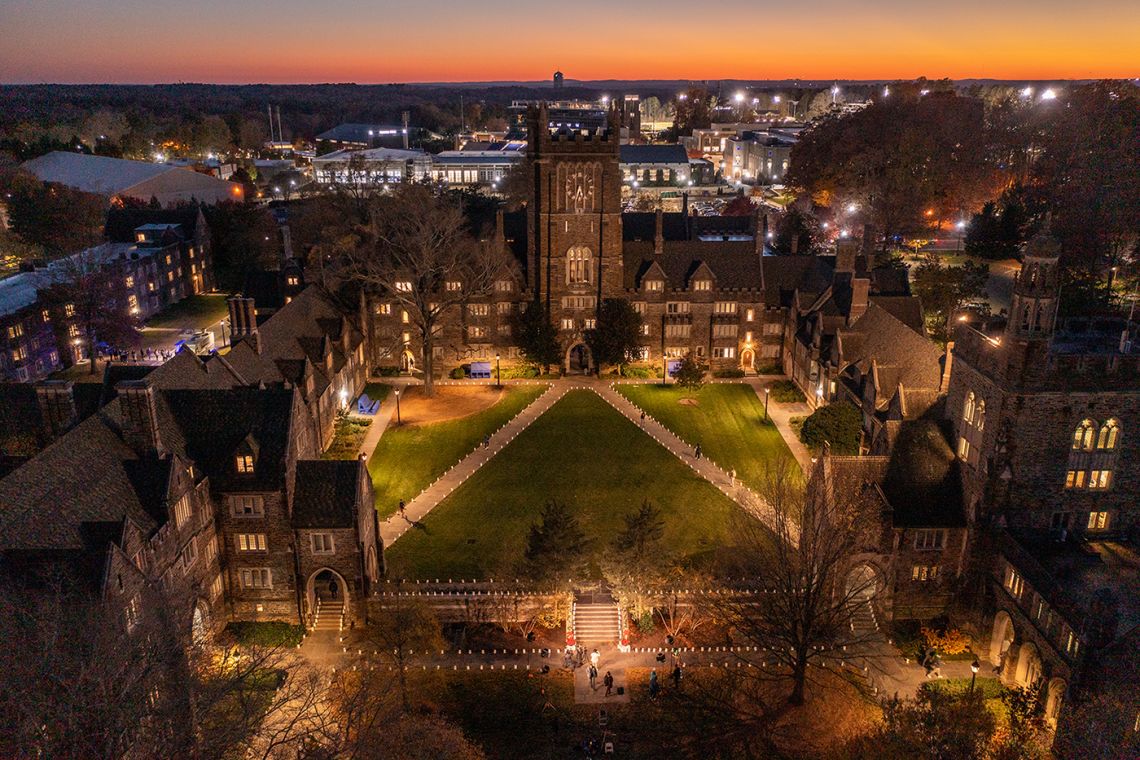 Photo from a drone of luminaries set out on Clocktower Quad for a holiday video message.