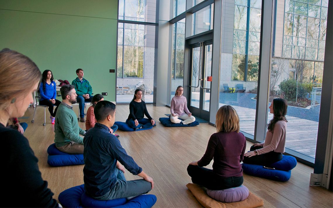 A guided meditation session, such as this one from prior to the COVID-19 pandemic, helps calm and focus the mind. Photo courtesy of DuWell.