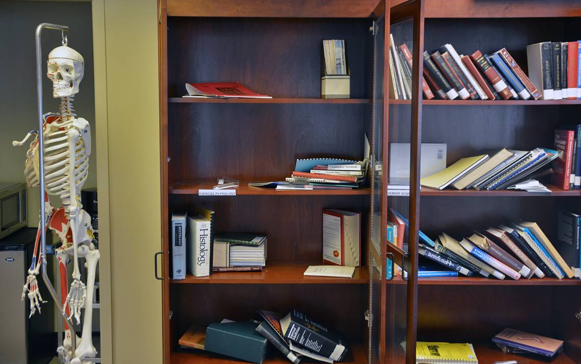 Bookshelves in the Duke Doctor of Physical Therapy Program office are emptying as staff members give away old textbooks and academic journals to students. 