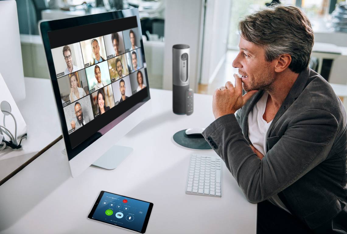 Video meetings with multiple people require more attention to focus on facial expressions and cues than in-person conversations and come with distractions such as noise and virtual background visuals. Photo courtesy of Zoom.