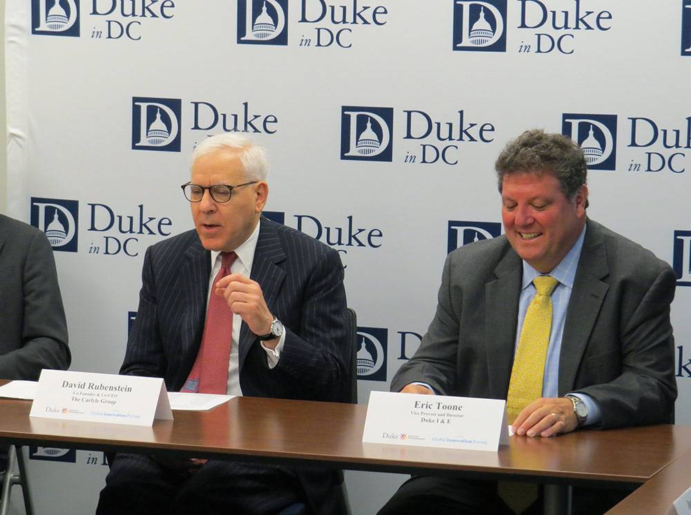 David Rubenstein and Eric Toone lead a panel discussion on universities and entrepreneurship in the Duke in DC Office. Photo by Jeff Harris