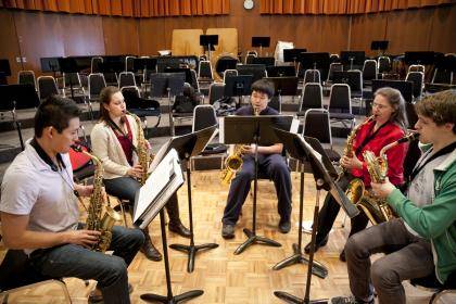 Duke student Samantha Giugliano, second from left, rehearses with other members of her saxophone ensemble. Photo by Jared Lazarus, Duke Photography.