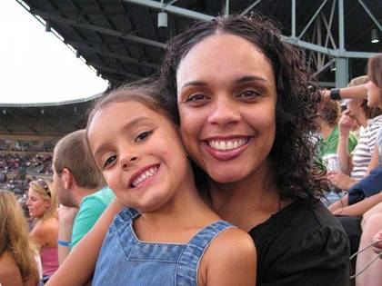 Makeba Wilbourn with her daughter, Justice, at the Durham Bulls Athletic Park.