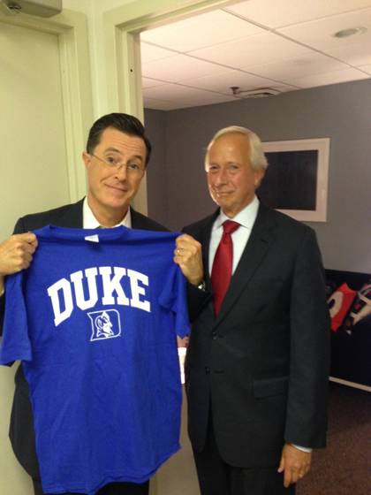 Duke President Richard H. Brodhead presents Stephen Colbert with a Duke jersey after the taping of 