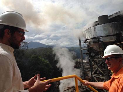 Duke sociologist Gary Gereffi, right, meets with John T. Wright Sol, whose family in El Salvador operates a sugar mill using environmentally friendly technology.