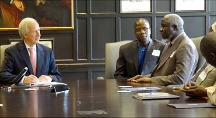 President Richard Brodhead talks with Duke Professor Mbaye Lo and Ahmad K. Sengendo, rector of the Islamic University in Uganda. Photo by Geoffrey Mock