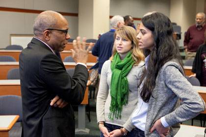 Randall Kennedy talks with two law students during his visit to Duke Wednesday.  Photo by Les Todd/Duke University Photography