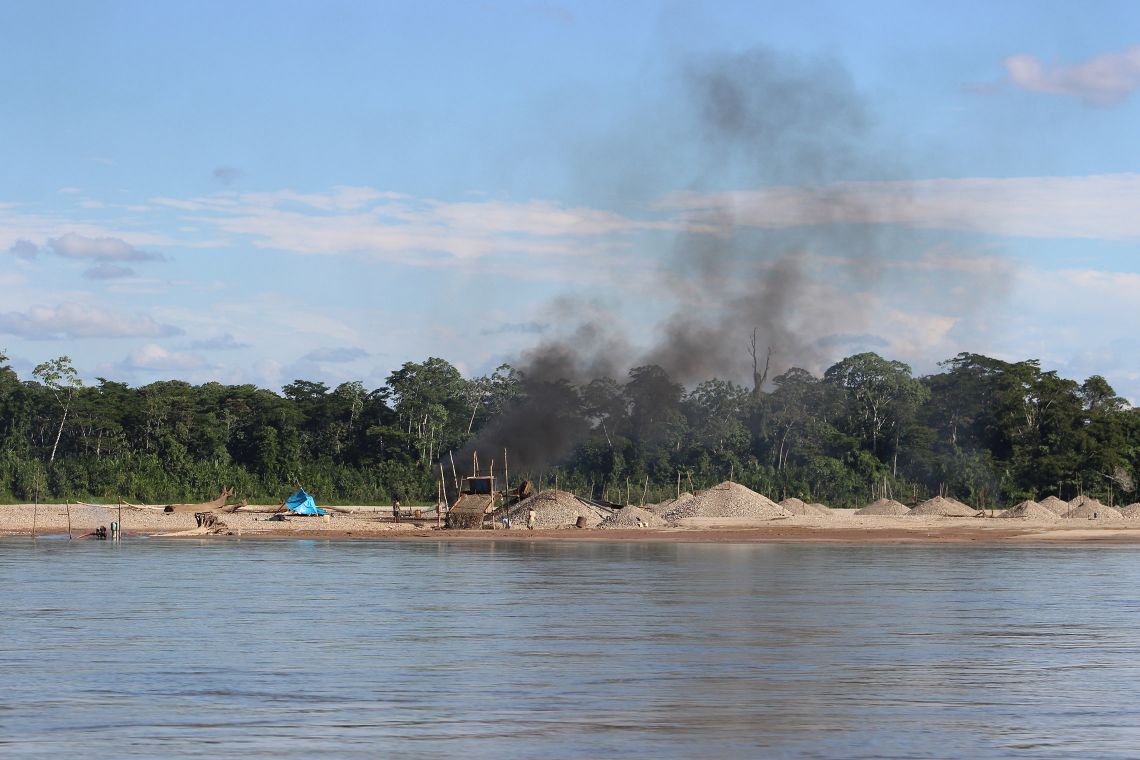 Illegal gold miners use mercury to bind gold particles, then separate the two metals by burning gold-mercury pellets in open fire ovens, releasing clouds of highly toxic mercury particles into the atmosphere. Credit - Melissa Marchese