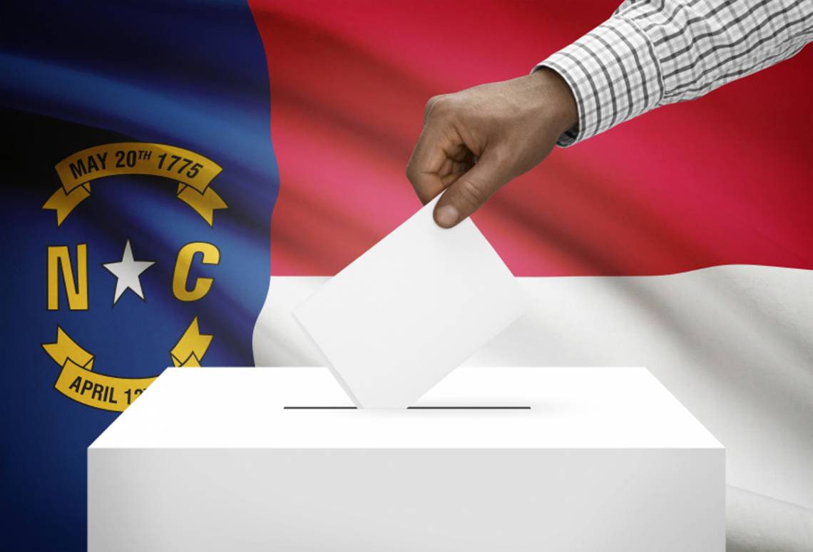 graphic image of a ballot being cast in front of the NC state flag