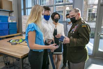 General Mark Milley, chairman of the Joint Chiefs of Staff, visits with students and professors in the Duke Engineering Wilkinson Building’s Christensen Family Center for Innovation. Representatives from the Design Health team Shock Value show Gen. Milley