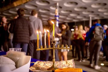 the lit candles show the move through the eight days of Hanukkah
