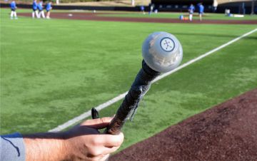 A sensor connected to the handle of a baseball bat helps Duke's baseball coaches learn more about players' swings. Photo by Stephen Schramm.