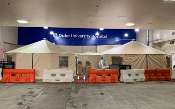 Triage tents are set up in the Duke University Hospital ambulance bay to receive patients experiencing COVID-19 symptoms. Photo courtesy of Jason Zivica.
