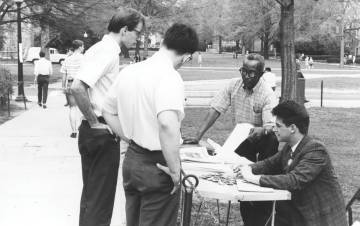 Oliver Harvey distributes literature in April 1967 on campus. Photo courtesy of North Carolina Collection, Durham County Library.
