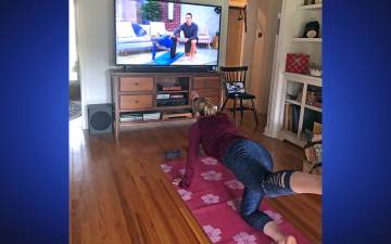 Beth Evans participates in a yoga class at home using Wellbeats. Photo courtesy of Beth Evans.