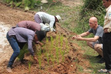  Boyd with rice planters in Cambodia