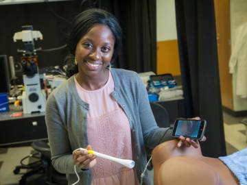Mercy Asiedu, a graduate student in Duke’s Global Women’s Health Technologies Center, shows the prototype speculum-free “pocket colposcope”