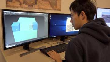 A student creates digital art at a computer Computational Media encompasses digital art, as well as theoretical and social aspects of digital tools.