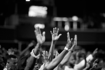 hands raised in a church service