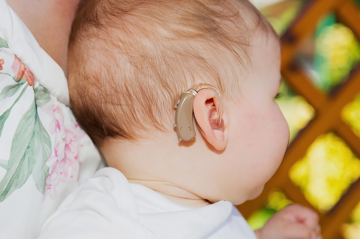 baby with a hearing aid