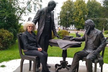 The author in Tomsk, Russia with a statue of the founders of Tomsk State University.