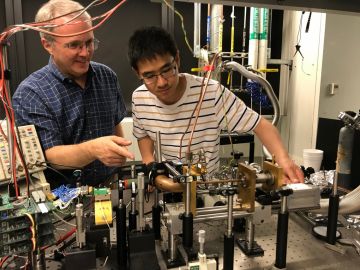 Duke professor Henry Everitt and then MIT graduate student Fan Wang with the first version of a tunable terahertz laser. Everitt's 