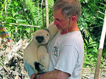 Bobby Schopler, staff veterinarian for the Duke Lemur Center, with a silky sifaka, one of the highly endangered species of lemur. Photo courtesy of Bobby Schopler.