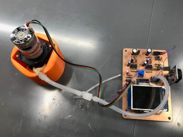 An early generation prototype of the tympanometer device that can modulate pressure, generate sound, and measure the reflected sound from the tympanic membrane